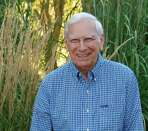 Wilmer Bloy in front of tall grasses