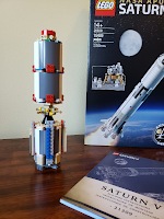 Lego pieces forming the first stage of a Saturn V rocket
